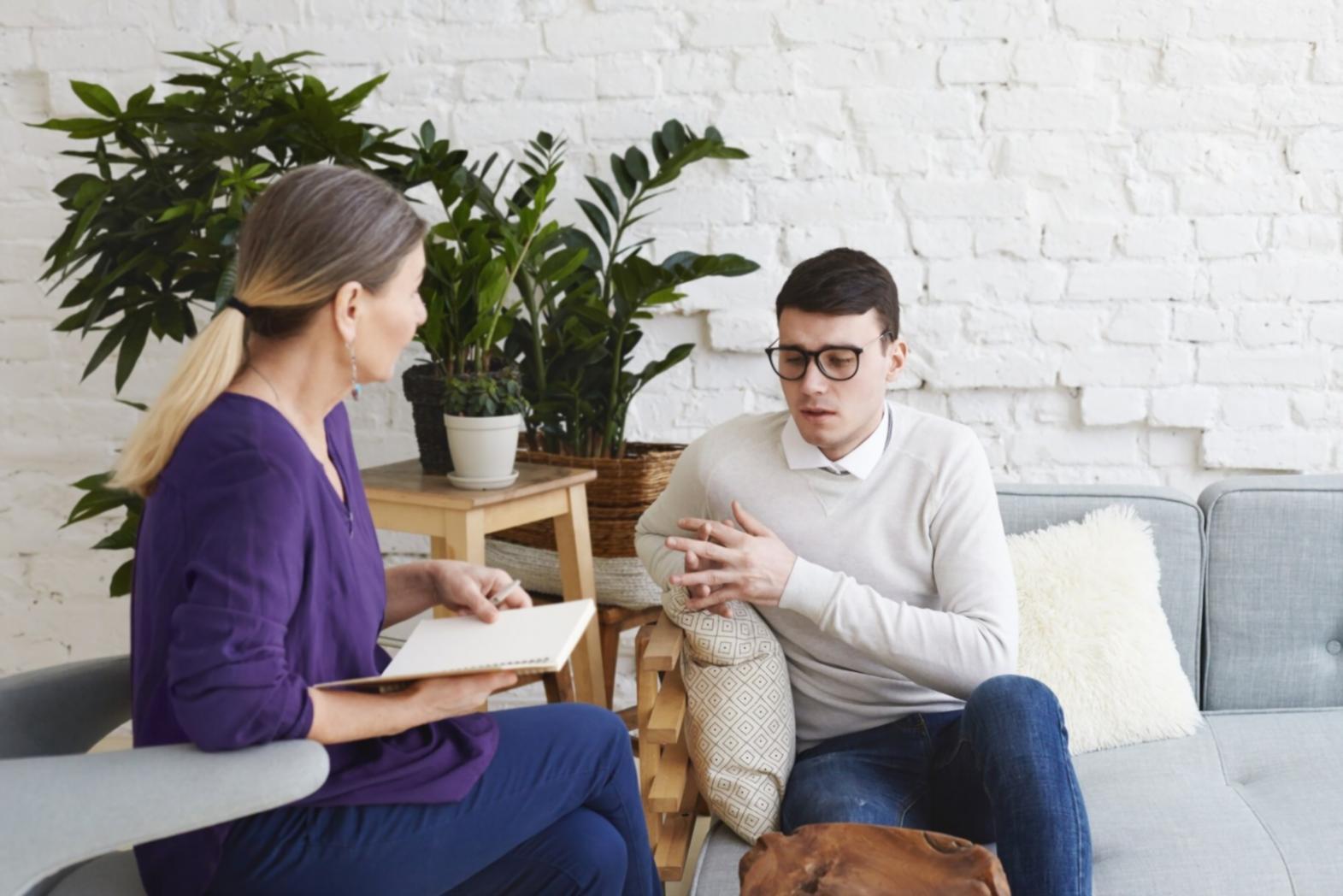 Professional reviewing presentation materials at home office workspace